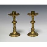 A pair of 19th Century brass candlesticks with shaped sconces 17cm x 8cm