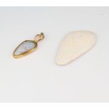 A loose unmounted opal 35mm x 18mm together with a yellow metal 14k mounted opal pendant 25mm