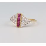 A yellow metal 18ct Art Deco style ruby and diamond ring, the princess cut rubies 0.35ct, the