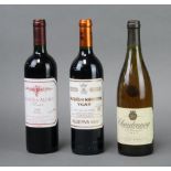 A bottle of 1997 Chardonnay Le Grand Chenin white wine, a bottle of 1999 Marques De Murrieta Ygay
