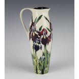 A contemporary Moorcroft ewer, the cream ground decorated with iris dated 2004, 27cm