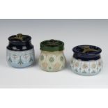 A Langley tobacco jar decorated with flowers 9cm, ditto 12cm and 1 other 13cm