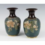 A pair of Langley oviform vases with incised floral decoration and flared necks 21cm