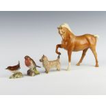 A Beswick horse H1549, head tucked, leg up, Palomino gloss by Pal Zalmen 19.1cm, a ditto of a