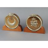 Two brass and chrome naval tompions marked Regent and Crescent, raised on teak bases 21cm h x 23cm w