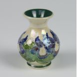 A contemporary Moorcroft baluster vase decorated with stylised flowers dated 2000, 8cm