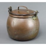 A circular copper, brass and steel cooking pot marked W2 24cm h x 26cm diam