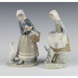 A Lladro figure of a goose girl and a Lladro figure of a girl with a rabbit at her feet both 23cm