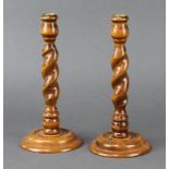 A pair of 1930's spiral turned light oak candlesticks with gilt metal sconces 25cm x 12cm