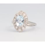 A white metal stamped Plat elliptical aquamarine and diamond ring, the centre stone 1.5ct, the