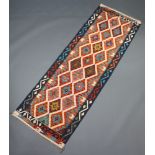 A tan, blue and green ground Chobi kilim runner with all over diamond design 246cm x 80cm