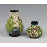 A Moorcroft squat shaped vase with floral decoration, base impressed Moorcroft 205 and with