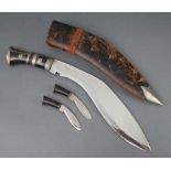 A Kukri with horn grip and 2 skinning knives, complete with scabbard