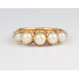 A yellow metal 5 stone pearl ring 5 grams, size P Additional images added.
