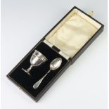 A cased silver egg cup and spoon Birmingham 1936, 32 grams