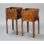 A near pair of Georgian style mahogany tray top commodes, the cupboard enclosed by panelled door