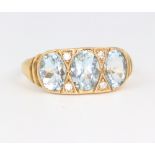 A yellow metal aquamarine and brilliant cut diamond ring the aquamarine approx. 1.9ct, the
