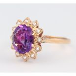 A 9ct yellow gold oval amethyst and seed pearl ring 3.5 grams, size P