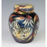 Moorcroft, a blue glazed floral patterned ginger jar and cover decorated butterfly, 15cm, the base