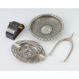A pair of Edwardian silver sugar nips, Sheffield 1908 2 dishes and a napkin ring
