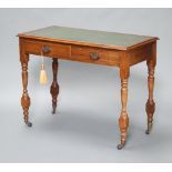 An Edwardian mahogany writing table with inset tooled green leather writing surface fitted 2 drawers
