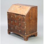 An 18th/19th Century walnut bureau of small proportions, the fall front revealing a well fitted