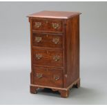 A Georgian style mahogany pedestal chest with canted and fluted corners fitted 4 drawers with