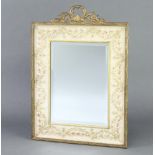 A 1930's Regency style rectangular bevelled plate mirror contained in a decorative gilt and