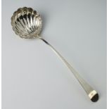 A George IV silver Old English pattern ladle with shell bowl with engraved monogram, London 1824,