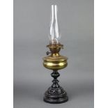 A Victorian Great Western Railway brass and pierced cast iron oil lamp with clear glass chimney, the