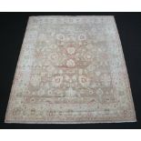 A Caucasian style white ground floral patterned rug with 301cm x 244cm