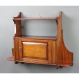 An Edwardian mahogany hanging cabinet fitted a shelf above cupboard enclosed by a panelled door 56cm