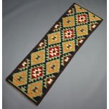 A black, green and tan ground Maimana kilim runner with all over diamond design 190cm x 63cm