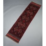 A red and blue ground Meshwani runner with 40 diamonds to the centre 235cm x 62cm