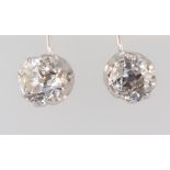 A pair of white metal mine cut diamond earrings, each approx. 0.4ctThese diamonds have an