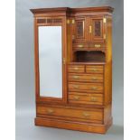 An Edwardian carved walnut combination wardrobe with shaped and moulded cornice, fitted a cupboard
