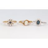 Three 18ct yellow gold gem set rings, sizes O, R and T, gross weight 11 grams