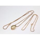 Two 9ct yellow gold necklaces 44cm and 54cm, together with a gold mounted pendant, gross weight 13.7