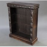 A Victorian carved oak bookcase 111cm h x 92cm w x 33cm d Some stains to the top