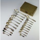 A quantity of 830 standard spoons, 296 grams, contained in a brass box