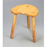 Robert Thompson, "Mouseman", an oak 3 legged stool the seat edge carved a mouse and raised on