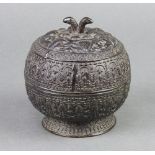 An Eastern circular cast bronze jar and cover raised on a spreading foot 9cm x 9cm