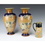 A pair of Royal Doulton salt glazed vases with floral decoration impressed 4841 34cm (one f and r to