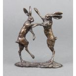 A bronze figure group of 2 boxing hares, base indistinctly signed 11cm x 10cm x 3cm