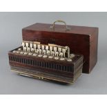 A 19th Century accordion with 22 buttons, complete with carrying case Brass stringing to the side is