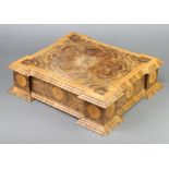 A walnut inlaid oyster veneered trinket box with hinged lid, raised on bracket feet 11cm x 43cm x