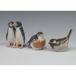 Two Royal Copenhagen figures of standing penguins 1190 9cm, ditto sparrow 1081 5cm and Robin 2266