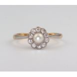 A yellow metal 18ct pearl and diamond cluster ring, 2.4 grams, size O The pearl measures 4.5mm and