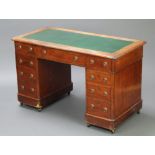 A Victorian bleached mahogany desk with green writing surface above 1 long and 8 short drawers, 74cm