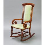 A small Victorian mahogany show frame bar back rocking chair upholstered in green material 102cm h x